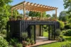 Container guest house with rooftop deck and pergola in bright daylight